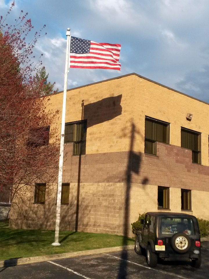 Unstuck American flag flies after being unstuck by Mr. Flagpole Maintenance