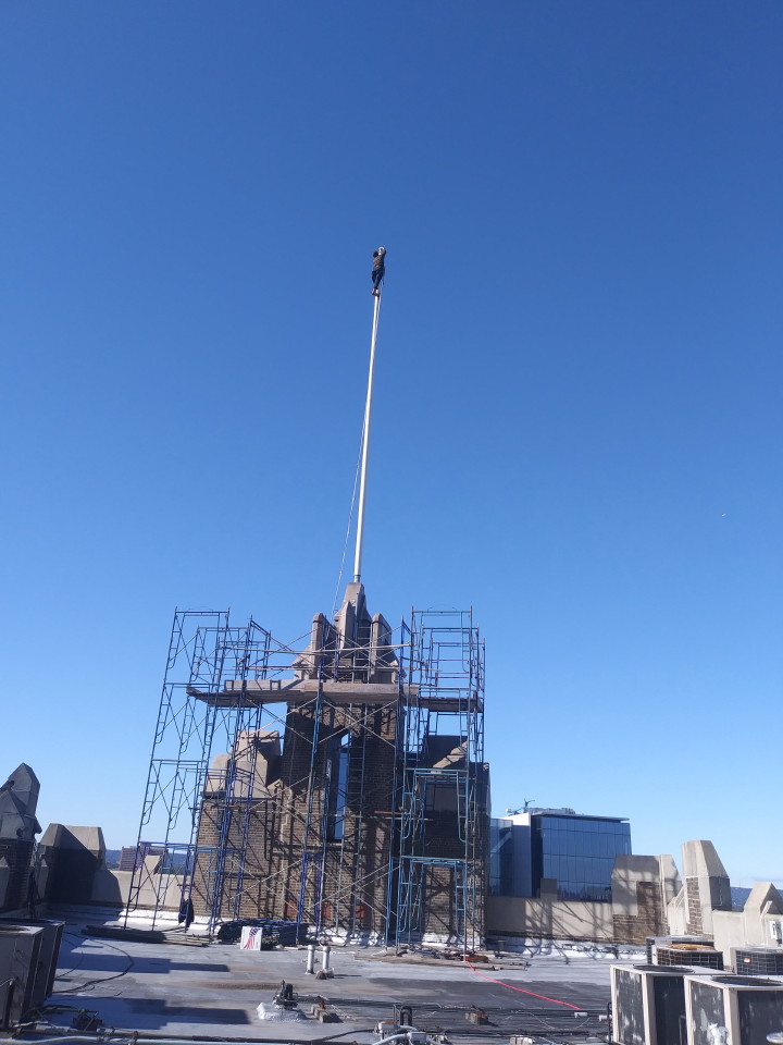 Stuck flag retrieval on top of a parapet wall - Mr. Flagpole Maintenance